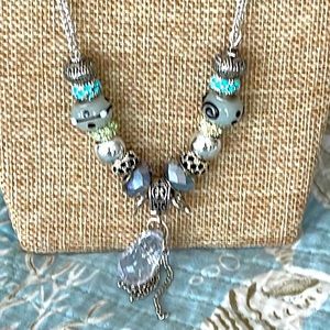 Interesting necklace with handmade glass beads and crystal embellished findings